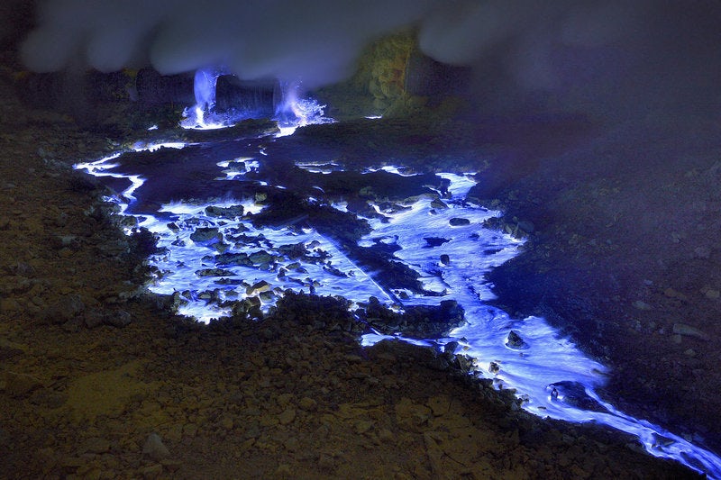 Escaped at gaseous state from the Kawah Ijen crater on Java Island in Indonesia sulfur combusts on contact with air, liquefies and run in impressive rivers of blue flames. Indonésia