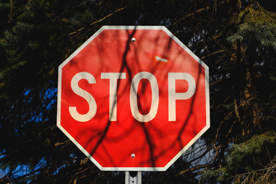 Stop sign in the woods.