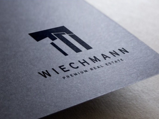 Wlechmann Real Estate business card