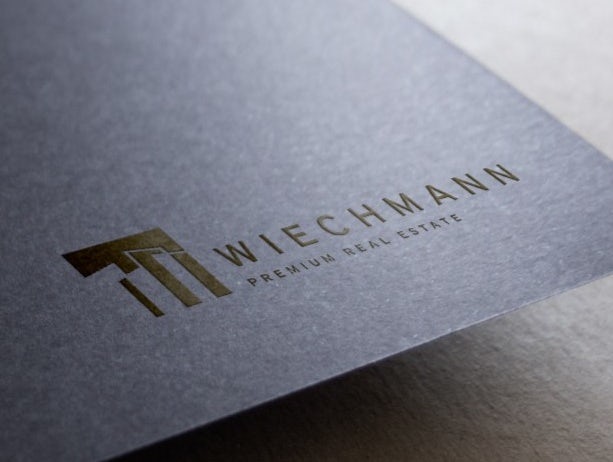 Wlechmann Real Estate business card