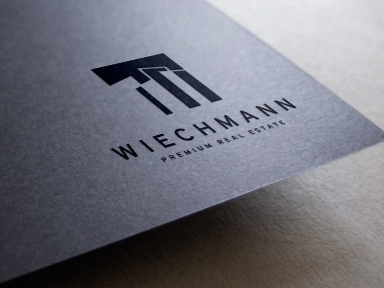 Wlechmann Real Estate business card