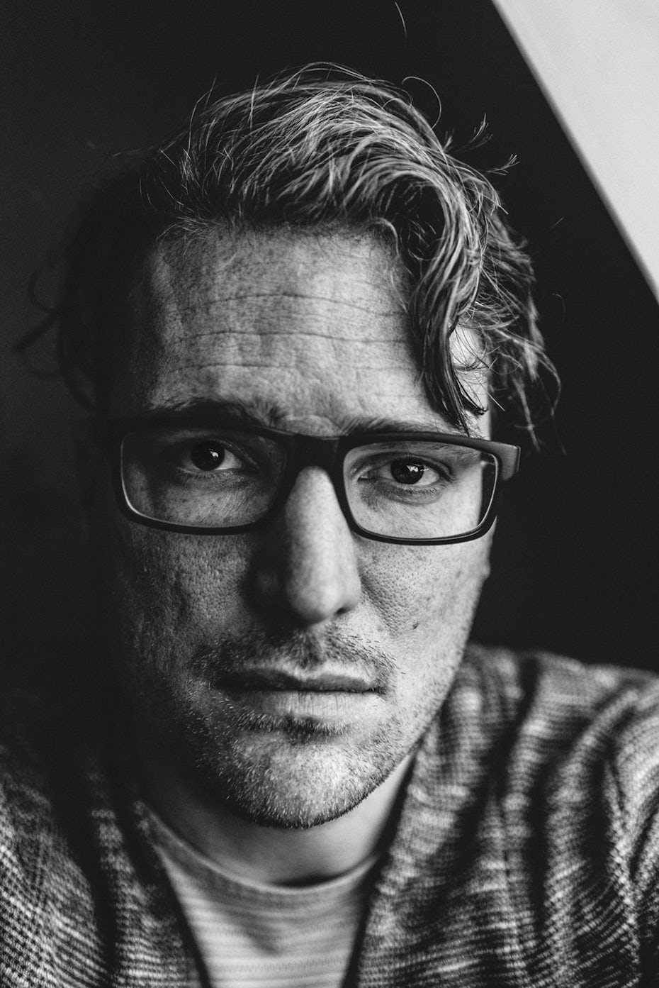 Headshot of man with glasses