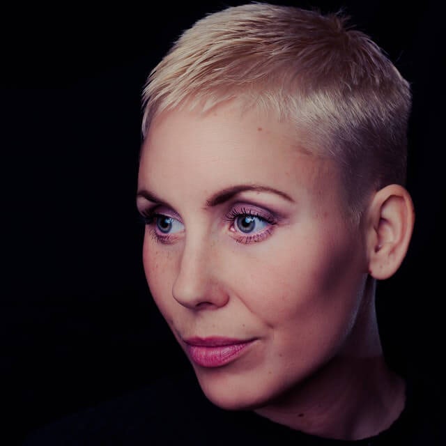 Headshot of woman with short blonde hair