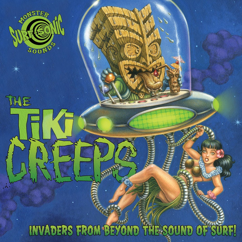 A tiki head in a flying saucer, holding onto a woman with its metal octopus tentacles