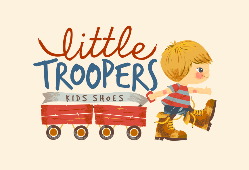Little boy in boots pulling two wagons with the text “Little Troopers kids shoes”