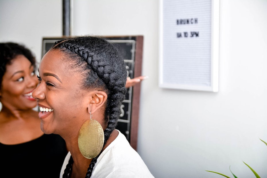 Two Black women laughing