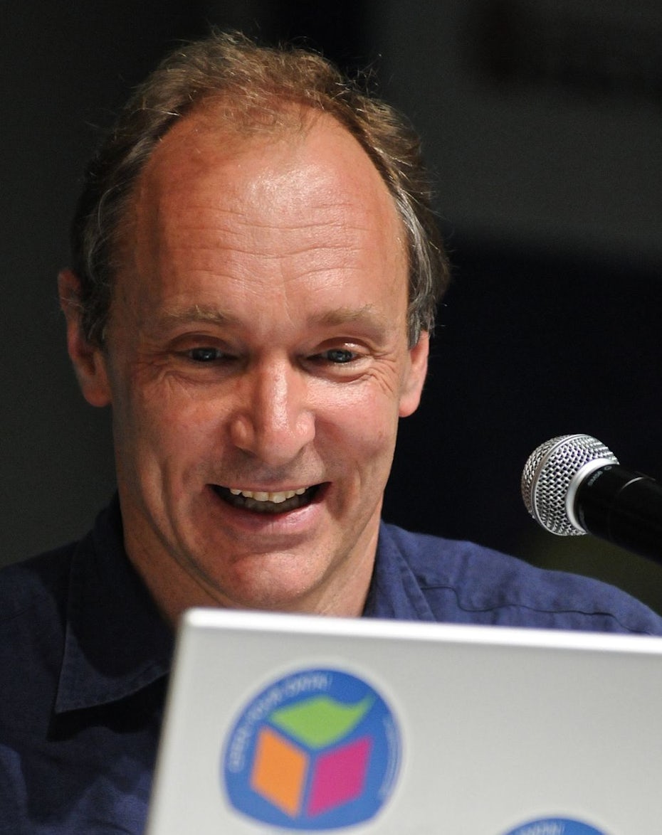 Tim Berners-Lee looking excitedly at a computer screen