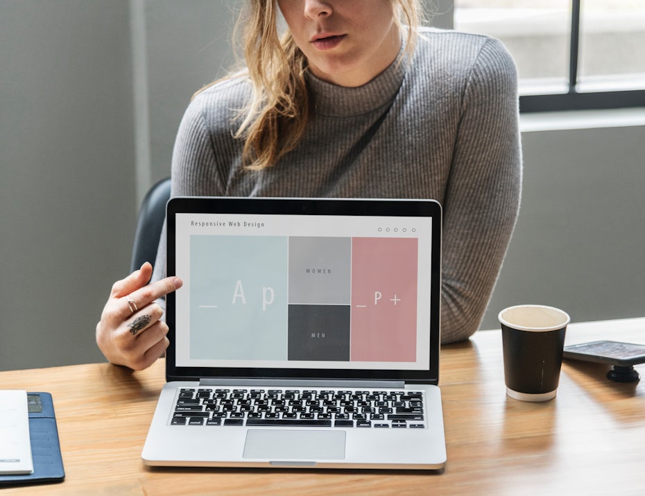 woman pointing at laptop screen