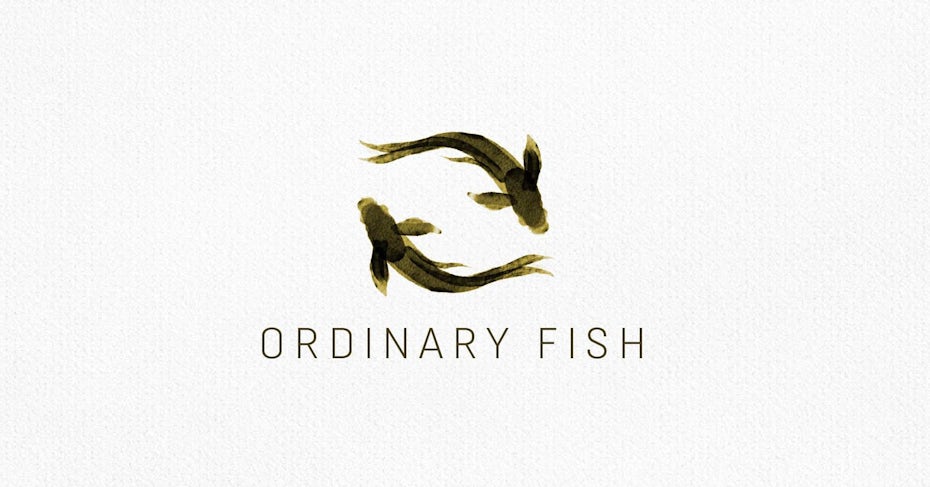symmetrical watercolor two fish logo