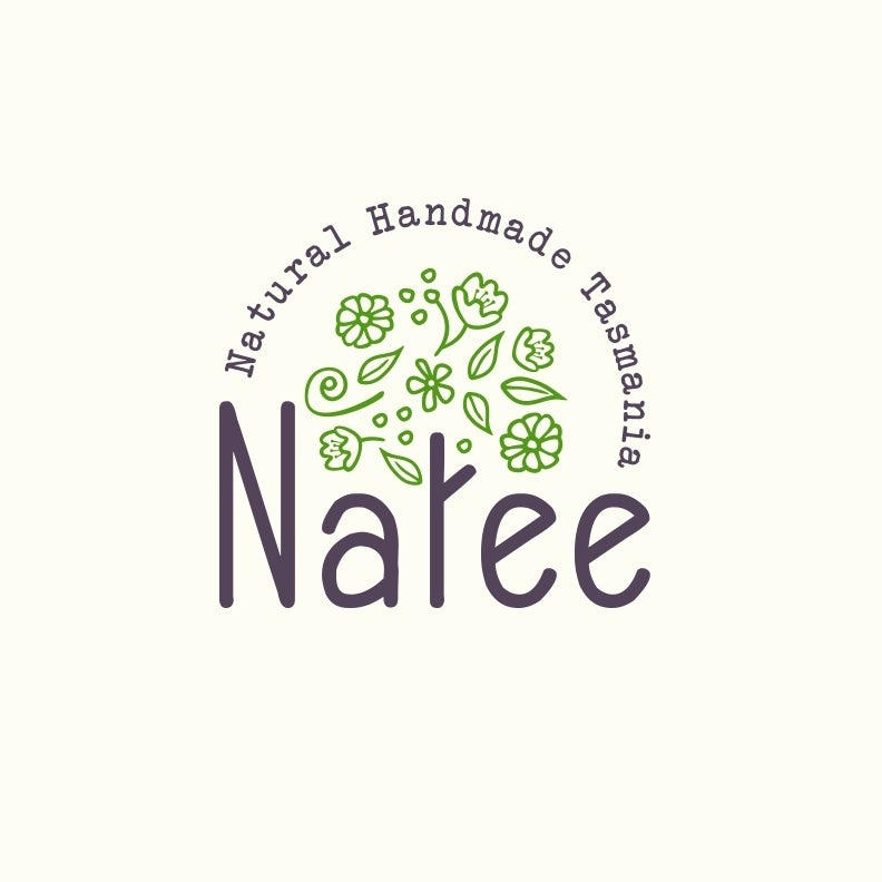 round logo with the letter “t” in “Natee” illustrated as a tree trunk with green leaves and flowers floating above it