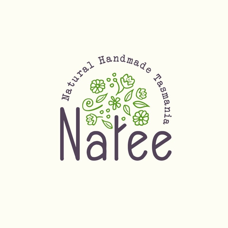 round logo with the letter “t” in “Natee” illustrated as a tree trunk with green leaves and flowers floating above it