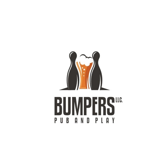 two bowling pins standing with a beer glass between them