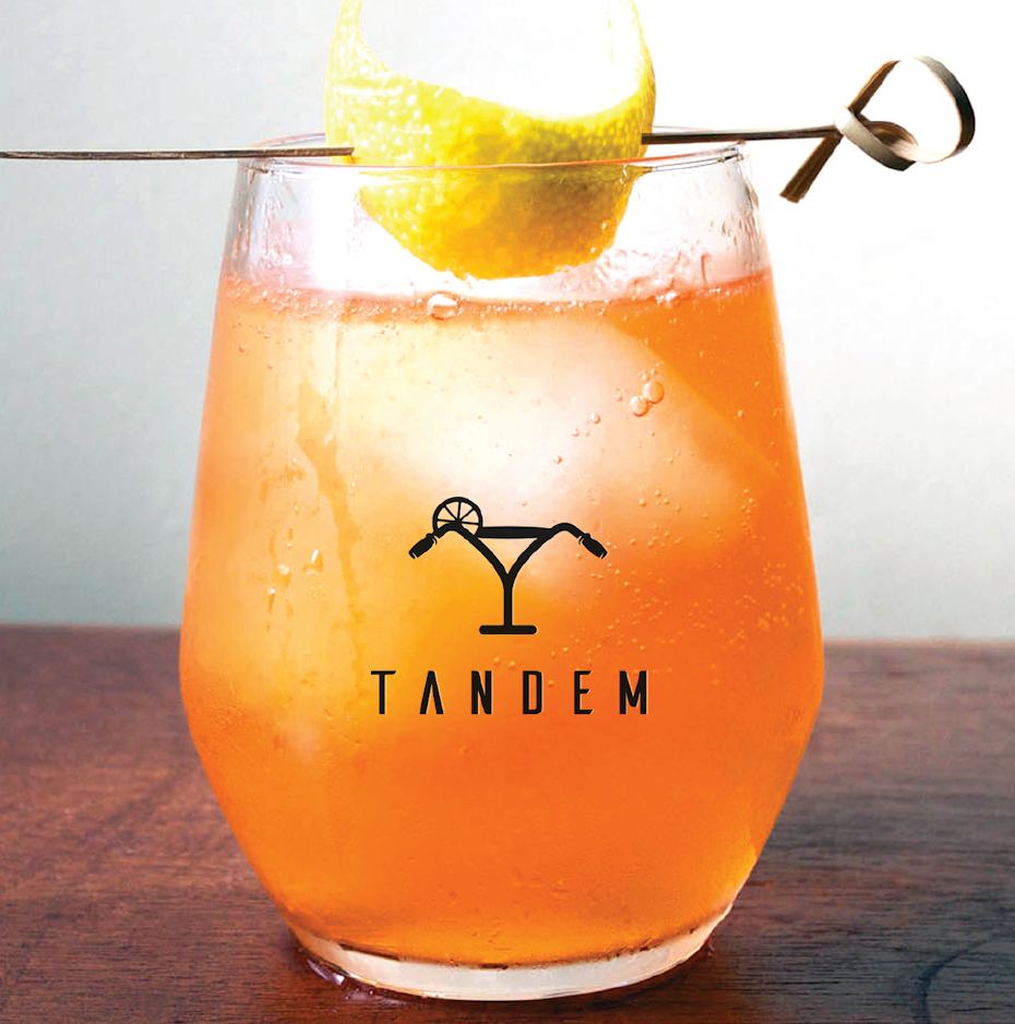 modern cocktail bar logo with cocktail glass in shape of bike handle
