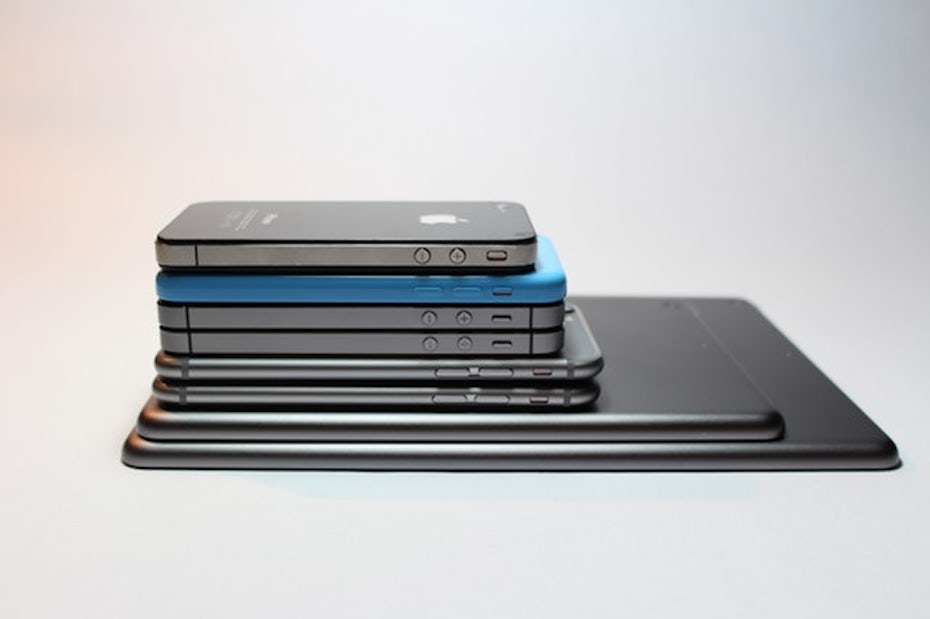 stack of smart phones and tablets