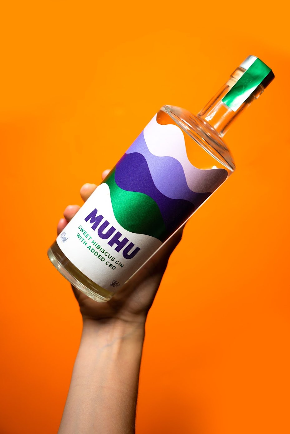 MUHU label design on orange background