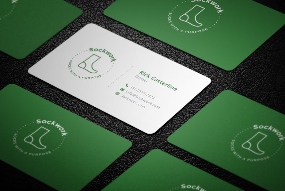 Green and white business cards with images of socks on them