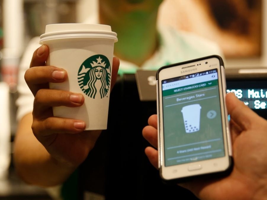 starbucks mobile app next to cup