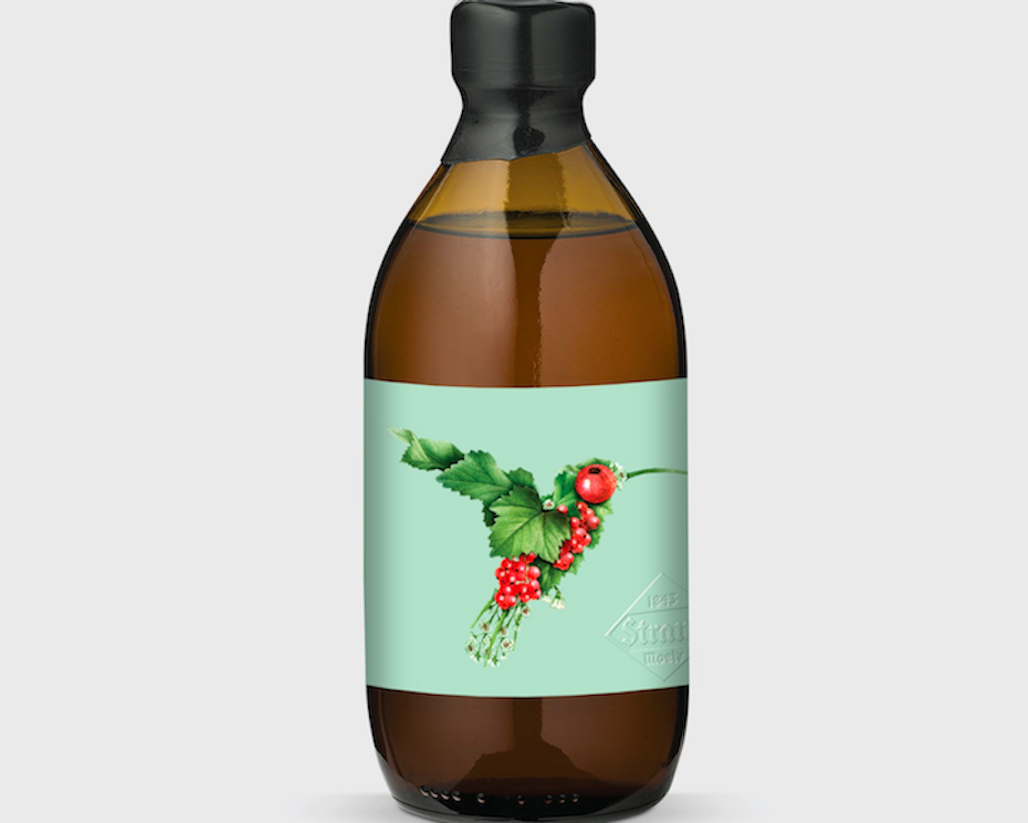 bottle label showing a hummingbird collage design created with smaller images of leaves and berries