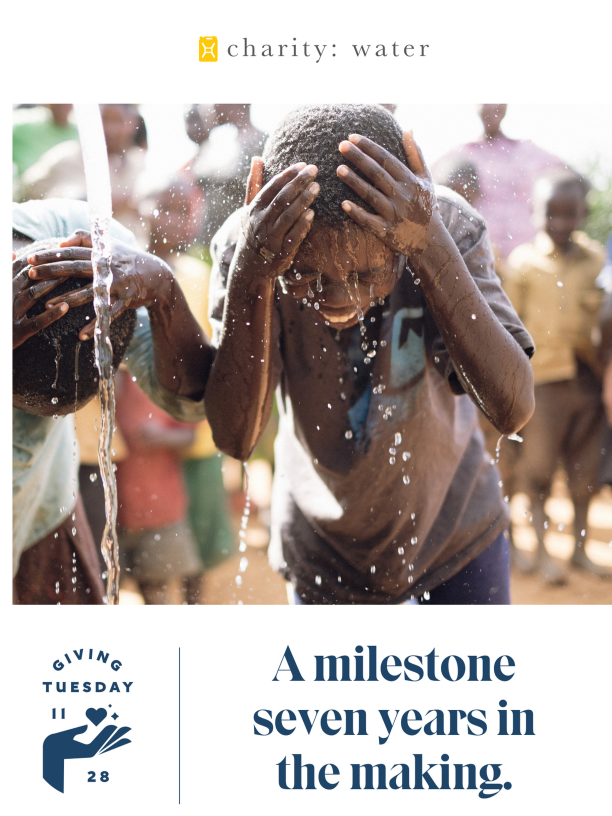 giving day newsletter featuring happy boys under pouring water
