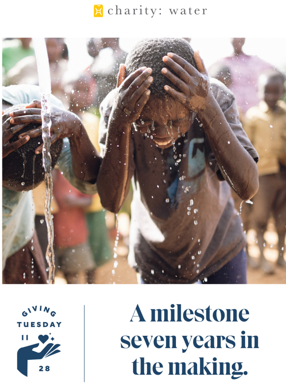 giving day newsletter featuring happy boys under pouring water
