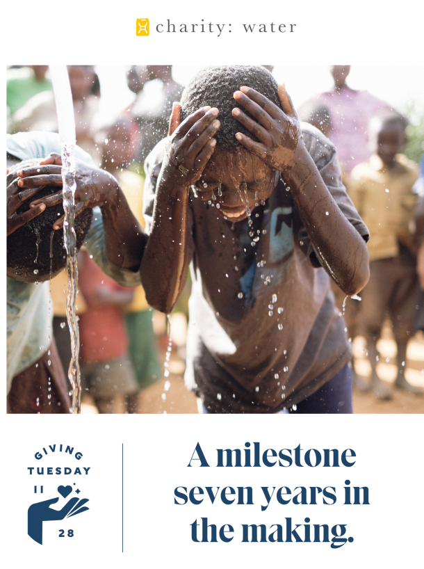 giving day newsletter featuring happy boys under pouring water