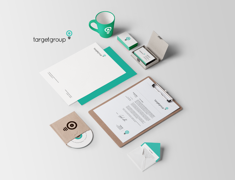clean and simple brand design with business cards, letters mug and stationery on a flat surface 