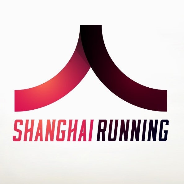 triangular logo with a red and maroon gradient