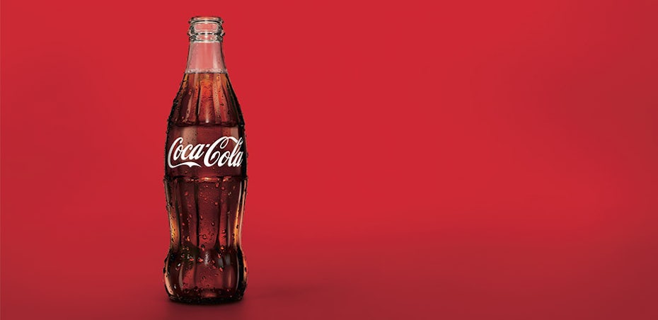 coca-cola bottle against red background