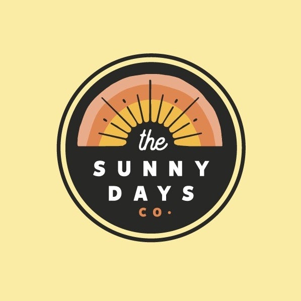 yellow, orange and peach logo showing a sunrise with negative space sunbeams