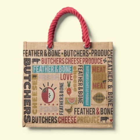 canvas bag showing a printed grocery design with images and words