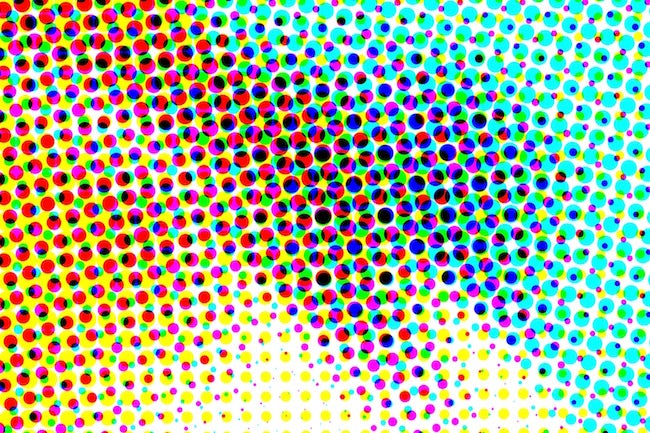 Des pixels de cyan, magenta, jaunes et noirs