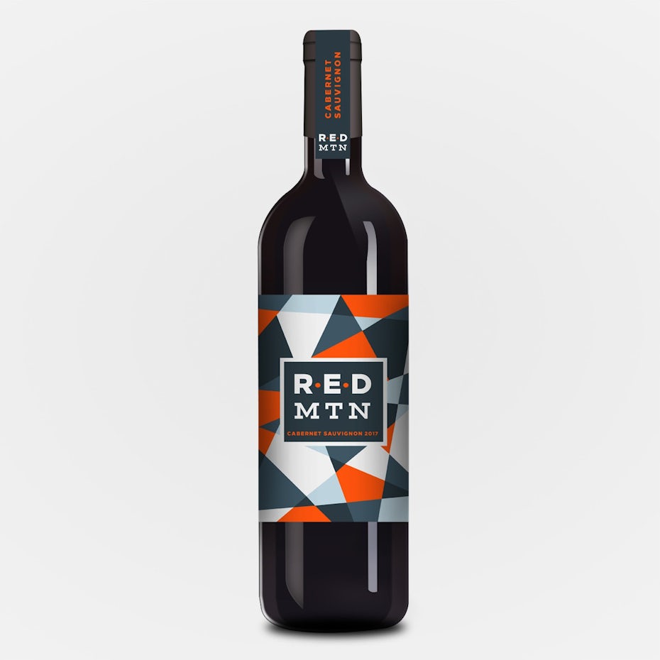 geometry packaging design trend: wine bottle with a sharp geometric gray and red label design