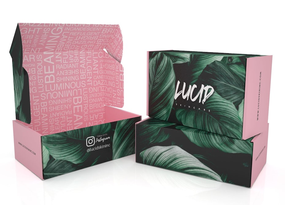 Pink skin care product packaging with green leaves