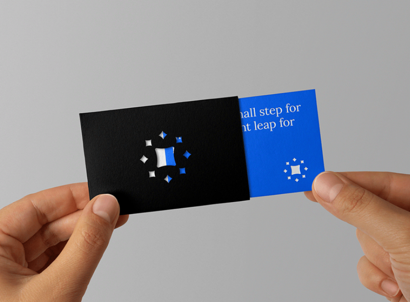 blue business card that fits into a black envelope