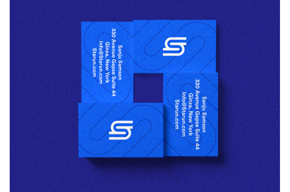 blue business cards with abstract S logo in white