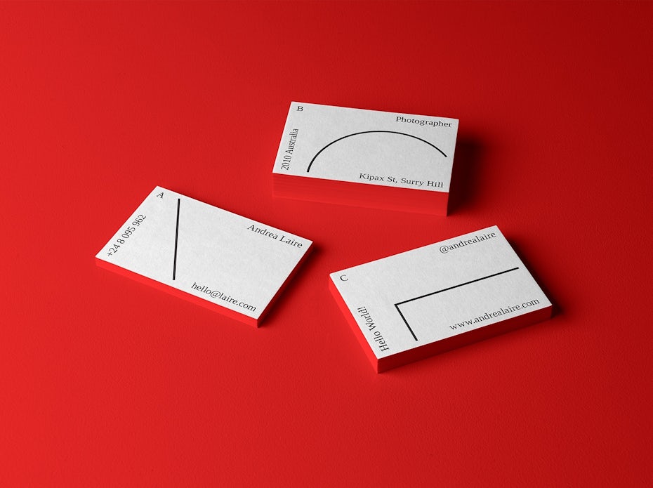 White business cards with minimalistic text and geometric lines