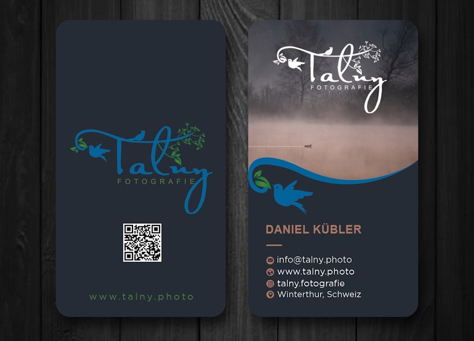 dark blue business card with a photo of a fog-covered lake