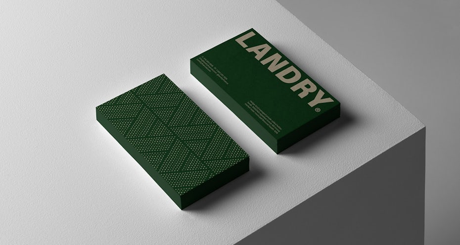 green business card with bold off-white text