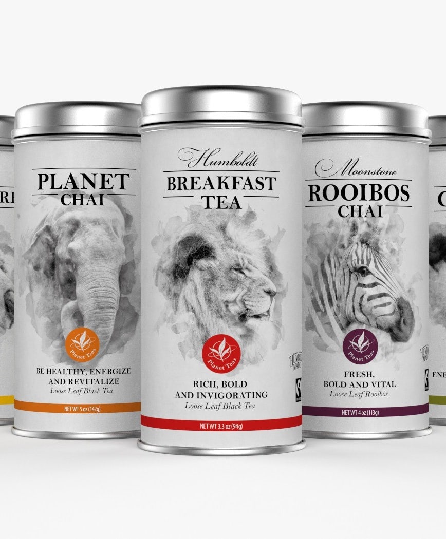 collection of white tea tins, each with a black and white photo of a different animal