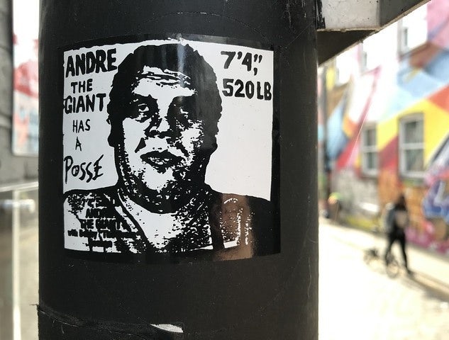 Andre the Giant sticker on a black pole