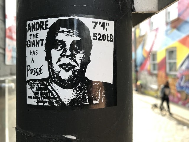 Andre the Giant sticker on a black pole
