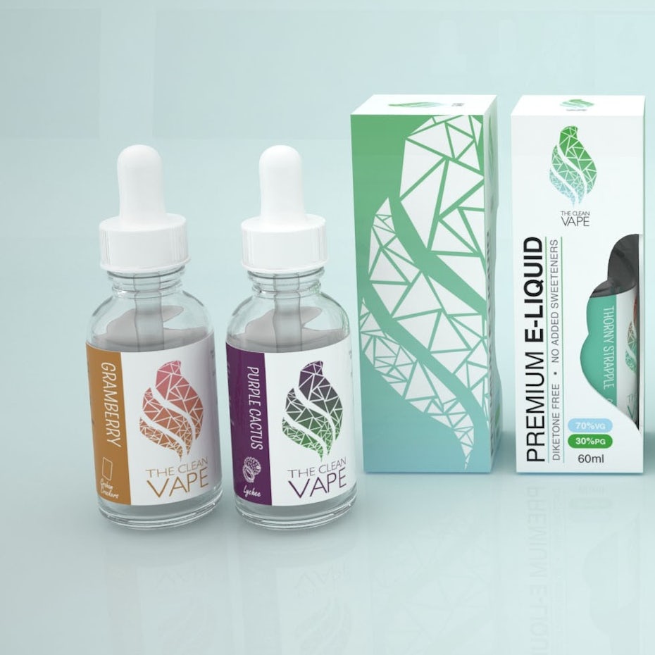 set of vape liquid bottles beside their branded boxes