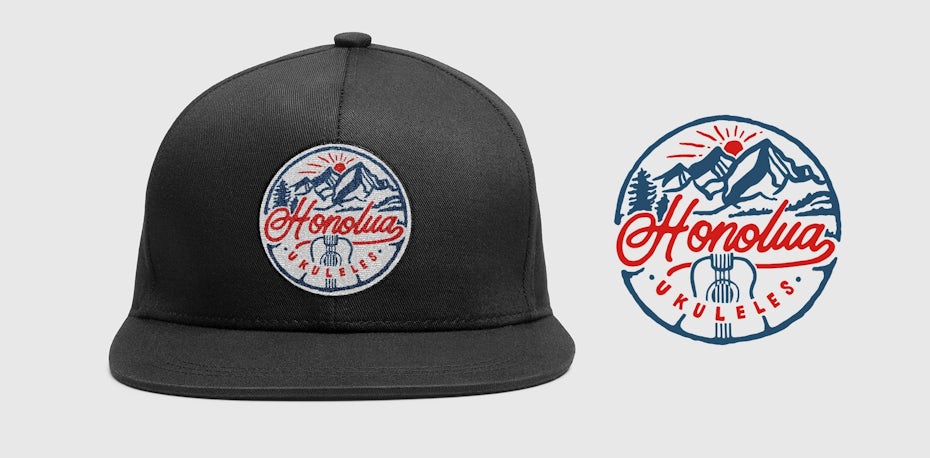 baseball cap with a red and blue logo showing mountains and a setting sun