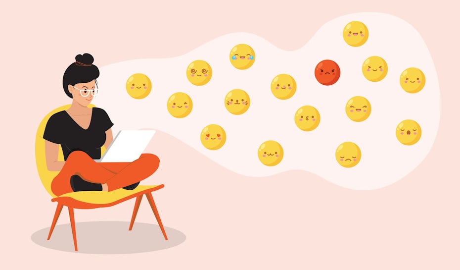 Illustration of a person sitting at a chair designing custom emojis