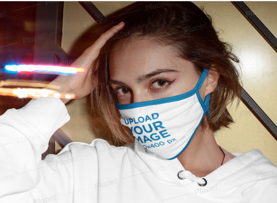 woman in a white hoodie wearing a white and blue face mask