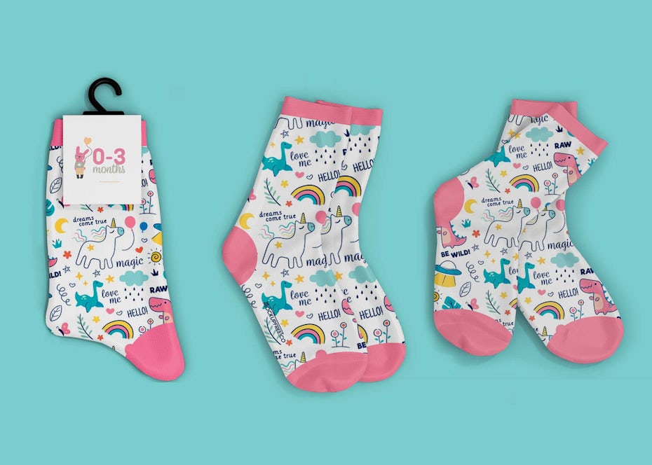 three pairs of baby socks with unicorns on them