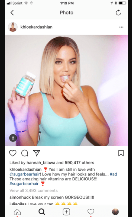 Instagram post showing Khloe Kardashian with a hair product