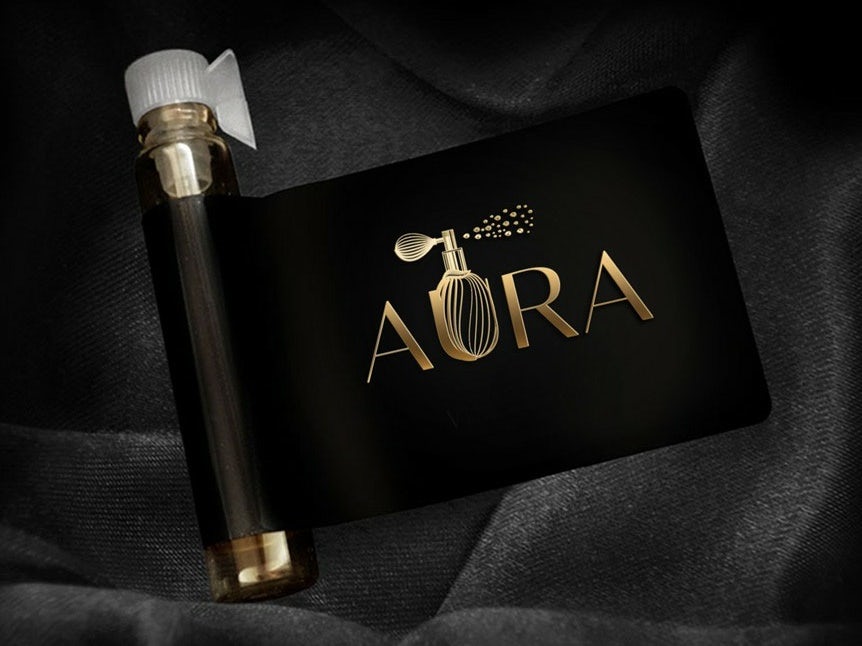 Perfume logo design with gold lettering