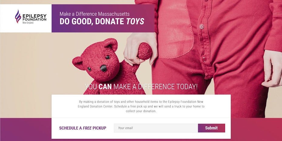hero image showing a child’s hand holding a pink teddy bear