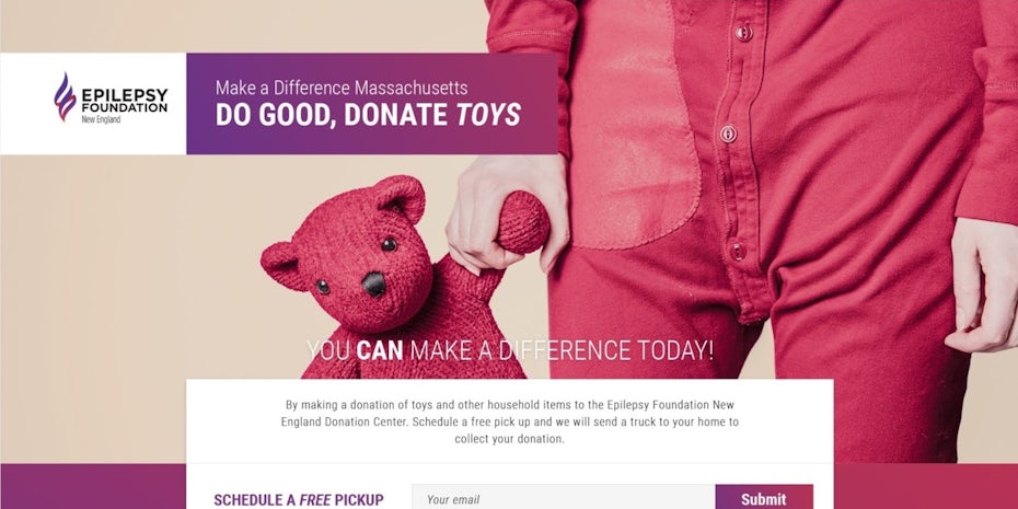 hero image showing a child’s hand holding a pink teddy bear